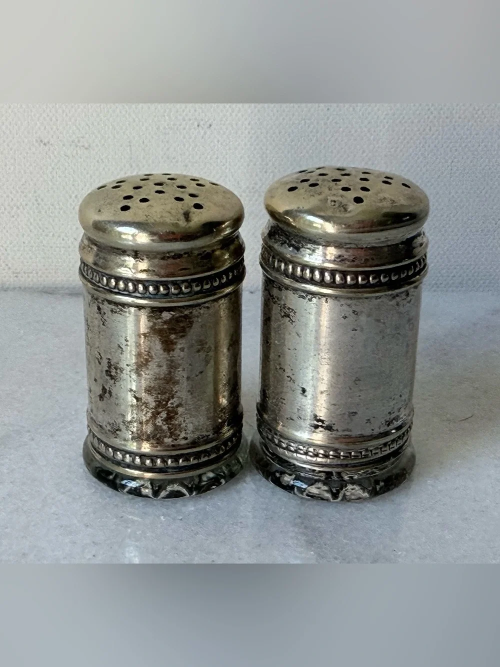 pair of antique EPNS silver salt and pepper shakers